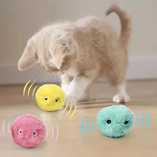 A cat playing with the Interactive Electric Cat Toy Ball, featuring a soft plush design that’s gentle on paws for hours of fun