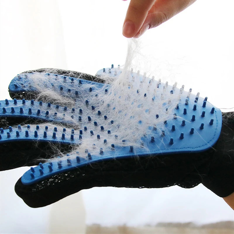 A pet owner using Pet Grooming Anti Shedding Gloves to groom a relaxed cat and reduce shedding.